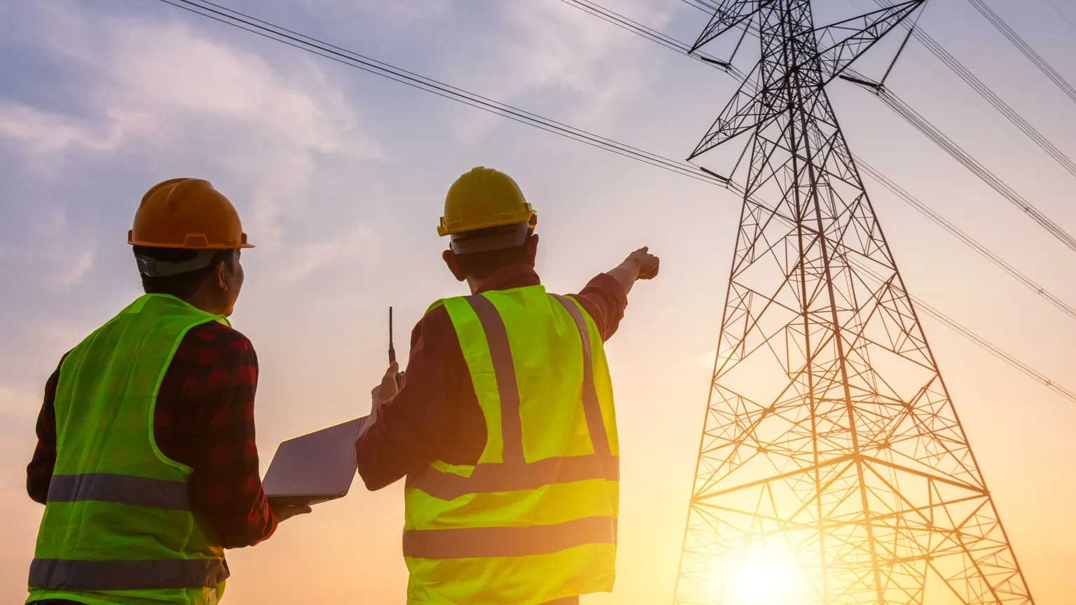 Image: Getty Images Utilities workers looking at electrical towers