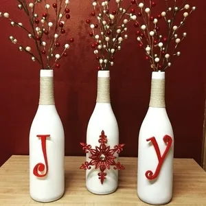 Image: Texas Uncorked on Etsy Wine bottles converted to decorative Christmas vases from Texas Uncorked on Etsy
