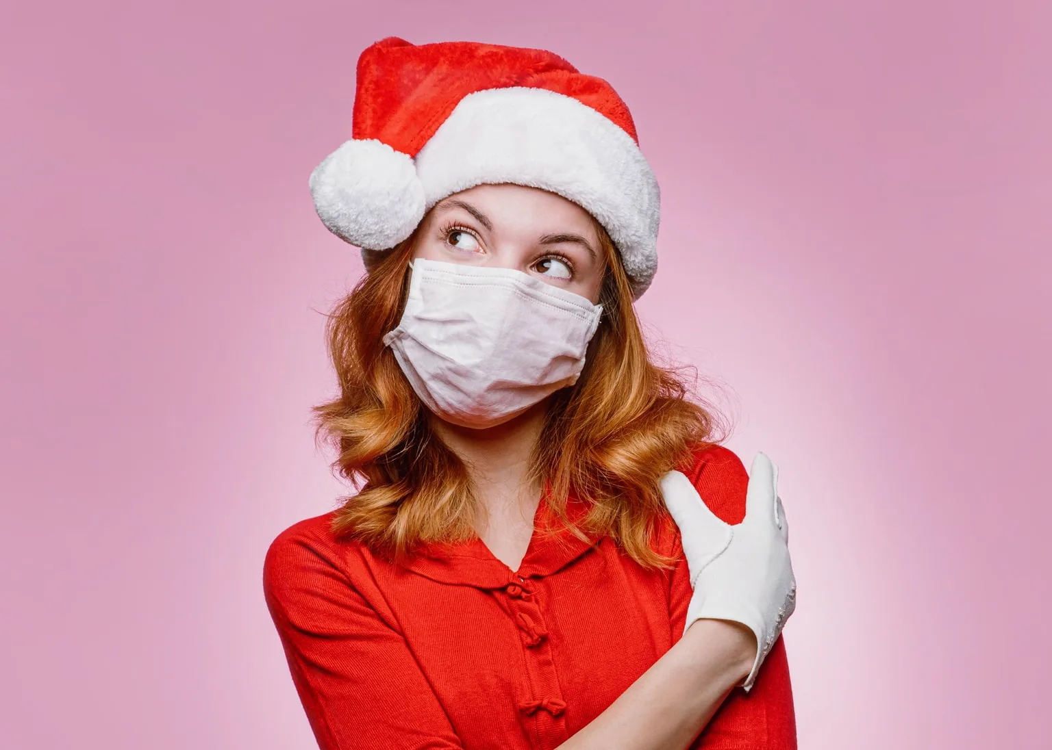 Image: Getty Images Woman dressed as Santa's helper wearing a protective face mask