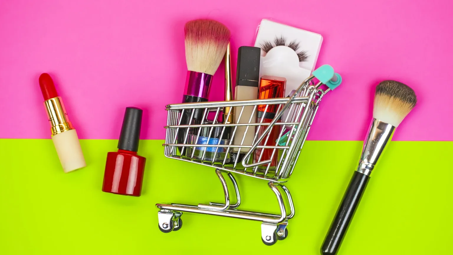 Image: Getty Images Grocery cart with makeup on pink and lime green background