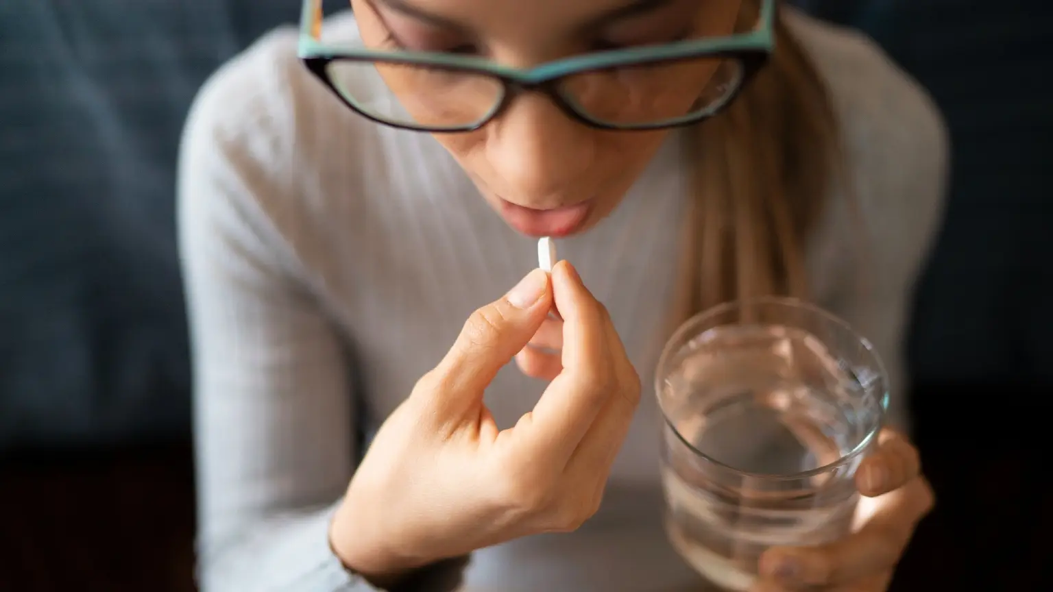Image: Getty Images girl drinking supplements