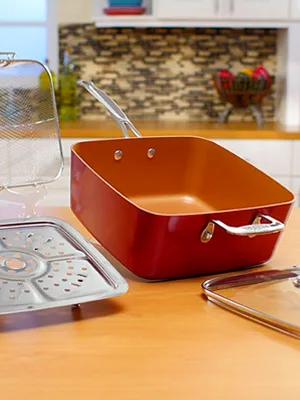 strainer and orange pan in the kitchen