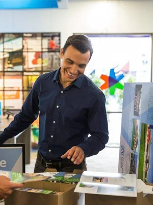 man looking at office prints