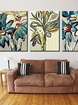 brown living room with three flower paintings on top