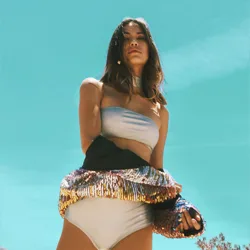 Girl wearing a swim suit and a shinny jacket