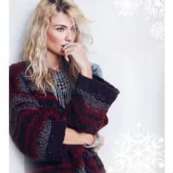 Blonde girl wearing colored sweater