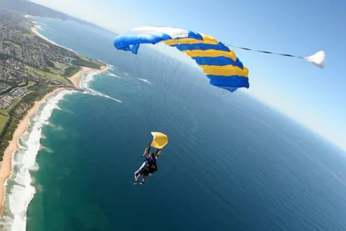 Tandem Skydiving Over The Beach